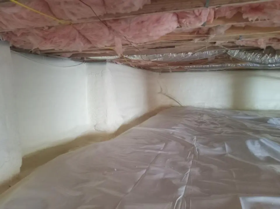 Crawl space encapsulation with closed-cell spray foam for Commercial Roof Restoration in New Castle